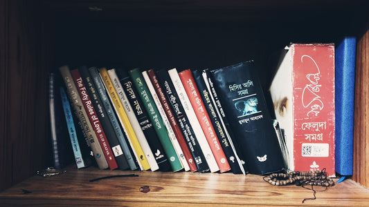 books on brown wooden shelf