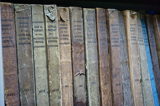 brown and black hardbound books