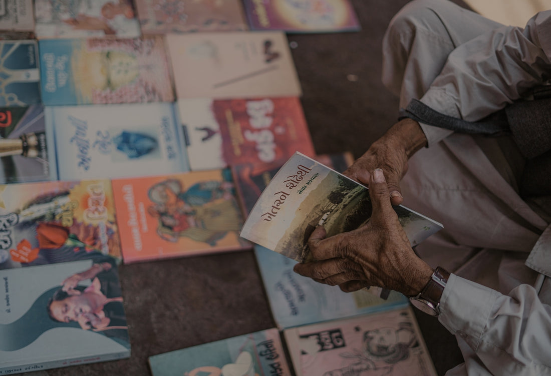 a man is holding a book in his hands