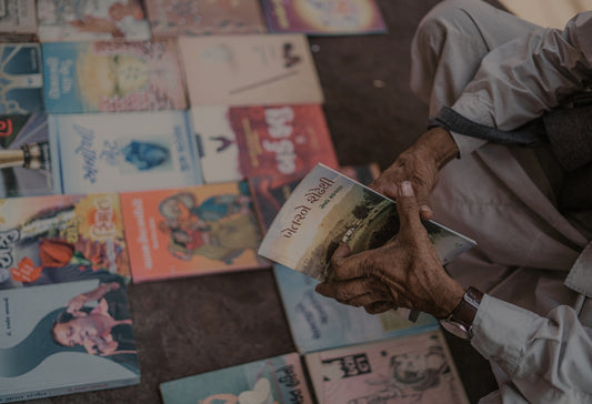a man is holding a book in his hands