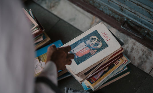 a stack of books sitting on top of a table