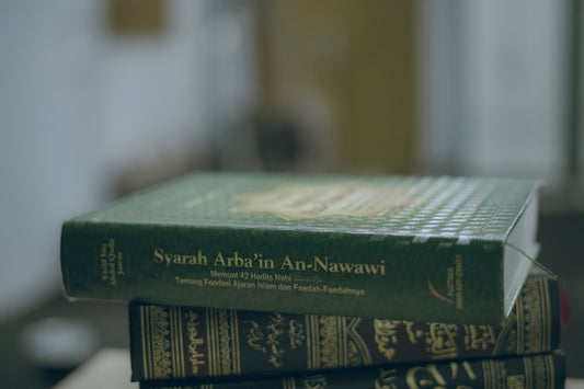 A stack of books sitting on top of a table