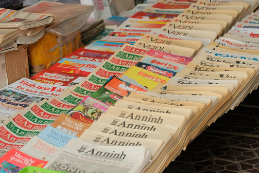 Newspapers and magazines displayed on a table
