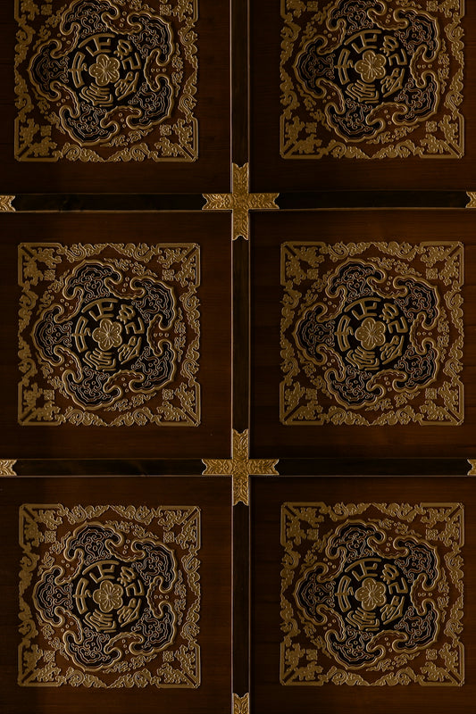 Six ornate wooden panels with intricate gold designs.