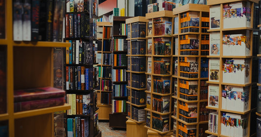 Rows of books on shelves in a bookstore.